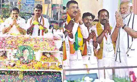 Edappadi K Palaniswami during his roadshow in Salem, PM Narendra Modi during his campaign in Chennai (File photos)
