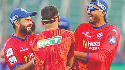 Delhi’s Rishabh Pant and Axar Patel share a laugh at a training session