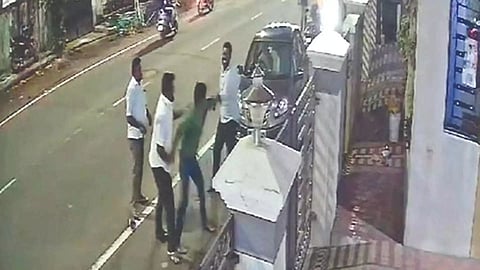  Political functionary being beaten up by two others on a street in Chennai 