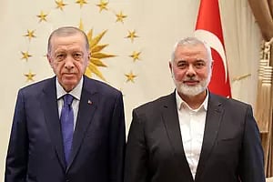 Turkish President Recep Tayyip Erdogan with Hamas' political bureau head Ismail Haniyeh