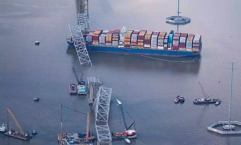 View of the Dali cargo vessel which crashed into the Francis Scott Key Bridge causing it to collapse in Baltimore
https://www.dtnext.in/news/world/biden-to-survey-collapsed-baltimore-bridge-meet-families-of-workers-who-died-778116