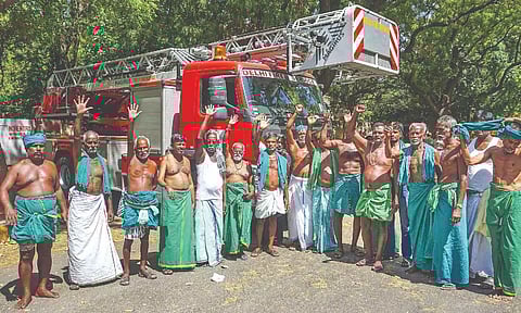 TN farmers protest at Jantar Mantar after grounded from mobile towers by DFS using sky lifts in Delhi on Wednesday