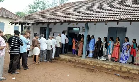 People stand in queue for casting their votes (IANS) 