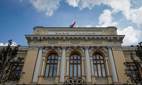 A Russian state flag flies over the Central Bank headquarters in Moscow, Russia (Reuters)
