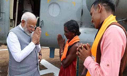 Prime Minister Narendra Modi meets Mohini Gowda, a fruit seller (ANI)