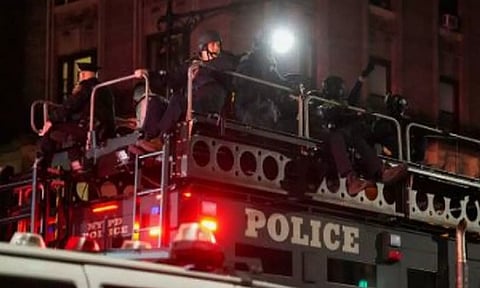 New York Police officers enter Columbia University. (Reuters)