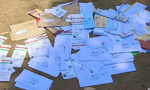 The discarded Aadhaar cards and other documents at Lalgudi in Tiruchy on Wednesday
