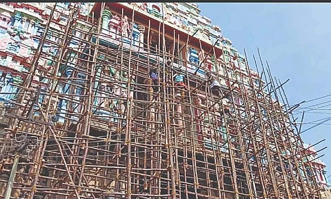 Work in action on the damaged east gopuram of Srirangam temple in Tiruchy