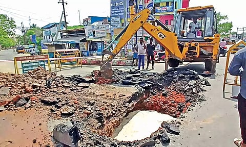 The civic staff fixing the damage caused on the Kumbakonam-Thanjavur highway on Saturday