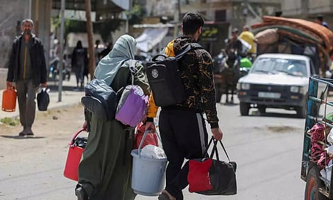 People flee the eastern parts of Rafah after the Israeli military began evacuating Palestinian civilians (Reuters)