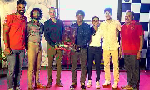 Royal Madras Yacht Club (RMYC) captain Murugan Nadar poses with the championship trophy