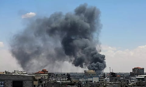 Smoke rises on Rafah after an Israeli strike as Israeli forces launch a ground and air operation (Image: Reuters)