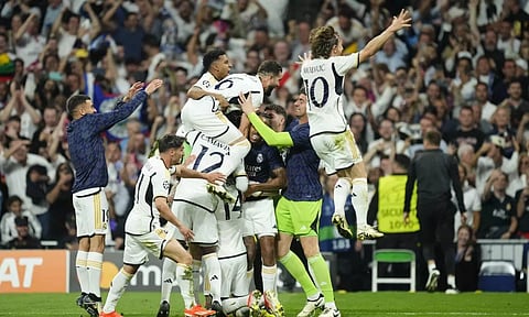 Real Madrid's Joselu covered by his teammates (AP)