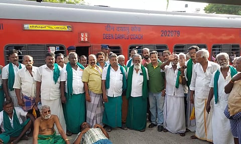 Farmers staging protest at Thanjavur Railway Station on Friday