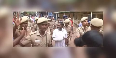  'Savukku' Shankar (in white) being taken from Coimbatore central jail to the government medical college hospital on May 13. (Thanthi TV screengrab)