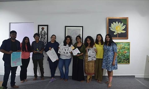Participants with their artworks created during the workshop, Planned Accidents