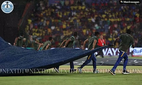 Covers come into the pitch due to rain in Bengaluru (Photo: Manivasagan N)