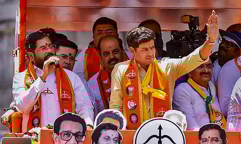 Maharashtra CM Eknath Shinde with Shiv Sena (Shinde faction) candidate Skrikant Shinde at a roadshow (PTI)