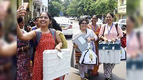 Polling officials leave for their respective polling stations carrying election materials on the eve of fifth phase of Lok Sabha polls (Image/ANI)