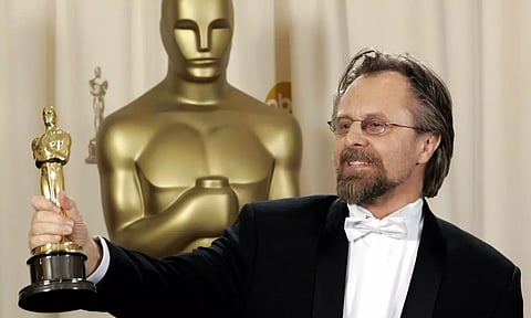 Polish composer Jan A.P. Kaczmarek poses with the Oscar for best original score for his work on “Finding Neverland” during the 77th Academy Awards (AP)