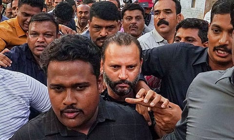 Builder Vishal Agarwal is brought at Pune Police Commissioner's office after his arrest (PTI)