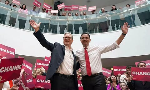 Britain’s Labour leader Keir Starmer, left, and Scottish Labour leader Anas Sarwar launch Scottish Labour’s General Election campaign at City Facilities in Glasgow, Scotland (AP)