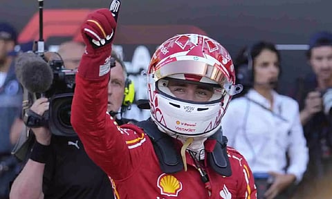 Charles Leclerc celebrates after taking pole position in Monaco GP (AP)