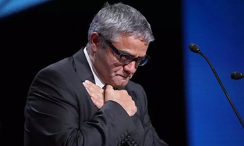 Mohammad Rasoulof accepts the special prize award for the film “The Seed of the Sacred Fig” (AP)