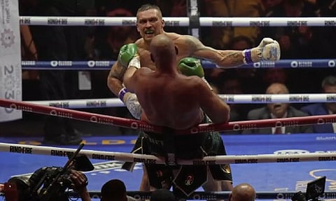 Ukraine's Oleksandr Usyk launches an attack on Britain's Tyson Fury during their undisputed heavyweight world championship boxing fight at the Kingdom arena in Riyadh, Saudi Arabia (AP)