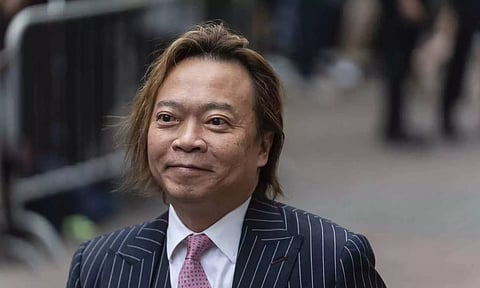 Lawrence Lau, former pro-democracy district councilor, arrives at court in Hong Kong (AP)