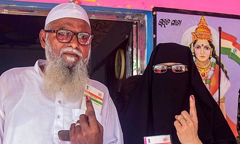 Voters show their fingers marked with indelible ink after casting votes during the last phase of the Lok Sabha elections (PTI) 