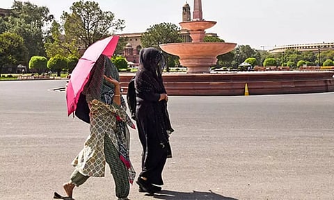Women walk at the Vijay Chowk while covering themselves with a dupatta (ANI) 