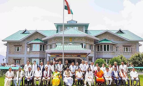 Sikkim Governor Lakshman Prasad Acharya and Sikkim Krantikari Morcha (SKM) leader Prem Singh Tamang with the newly elected legislators, in Mintokgang, Gangtok (PTI)