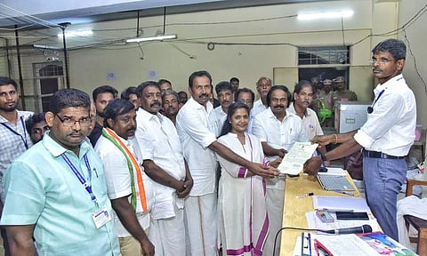 Tharahai Cuthbert of Congress receives her winning certificate from the RO in Vilavancode on Tuesday