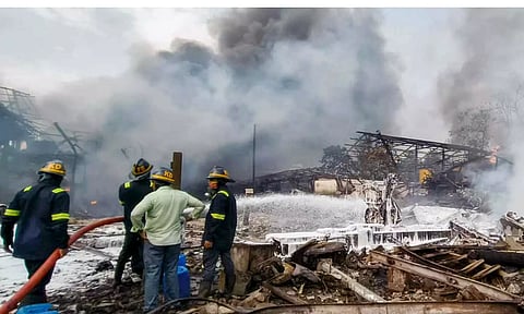 Firefighters try to extinguish a fire that broke out due to a boiler blast in a chemicals factory, at Dombivli (PTI)