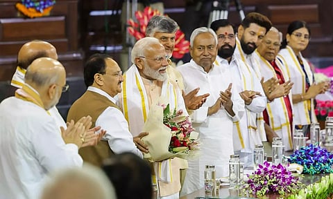 BJP President Jagat Prakash Nadda welcomes Prime Minister Narendra Modi during the NDA parliamentary party meeting at Samvidhan Sadan, in New Delhi (PTI) 
