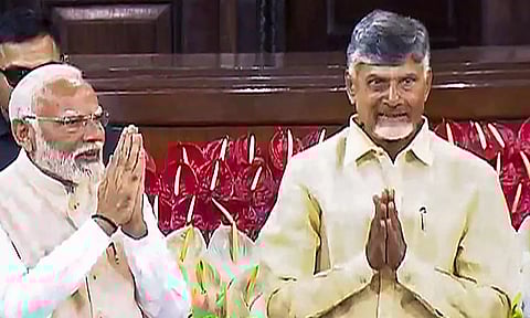 Senior BJP leader Narendra Modi with TDP chief N. Chandrababu Naidu during the NDA parliamentary party meeting at Samvidhan Sadan, in New Delhi (PTI)