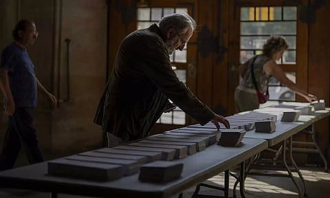 People choose their ballots for the European Parliament election, in Barcelona, Spain (AP)