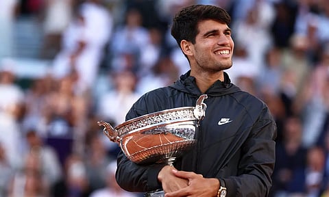 Alcaraz celebrates after winning the French Open title