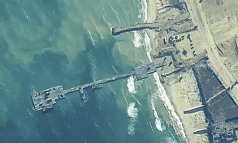 A key section of the U.S. military-built pier designed to carry badly needed aid into Gaza by boat has been reconnected to the Gaza beach following storm damage repairs and aid will begin to flow soon, the U.S. Central Command announced Friday. 