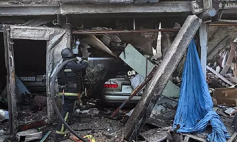 A rescue member works at a site of a Russian air strike, amid Russia's attack on Ukraine (Photo/Reuters)