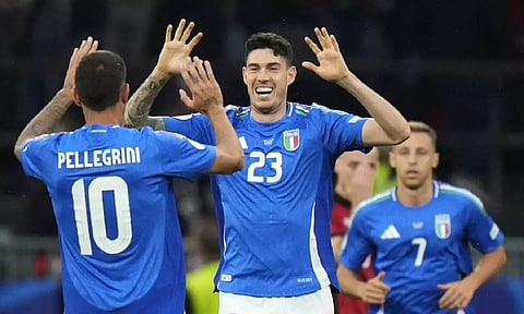 Italy's Alessandro Bastoni celebrates after a goal (AP)