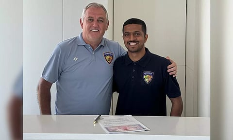 Chennaiyin FC defender Mandar Rao Dessai poses along with head coach Owen Coyle 