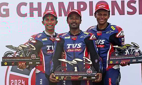 Jagan Kumar ( centre ), winner of the Pro-Stock 165cc open race, flanked by KY Ahamed (left) and Deepak Ravikumar