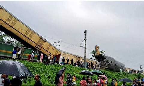 Locals gather after a collision between the Kanchanjungha Express and a goods train, near Rangapani railway station (PTI)