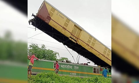  Locals gather after a collision between the Kanchanjungha Express and a goods train (PTI)