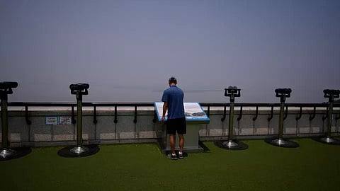A visitor looks at the map of North Korean side from the unification observatory in Paju, South Korea (Photo: AP)