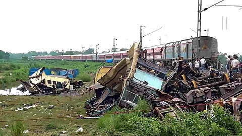 A train runs through the accident area following restoration of services a day after the collision between the Kanchanjunga Express and a goods train, near Rangapani railway station, Tuesday, June 18, 2024 (Photo/PTI)