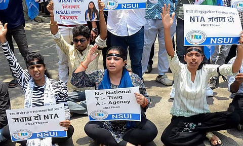 Members of AIDSO (All India Democratic Students' Organisation) shout slogans during their protest (Photo: PTI)