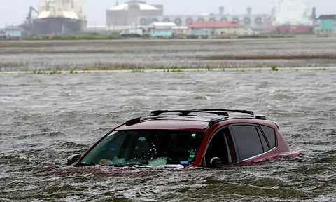 A car sits submerged in water as Tropical Storm Alberto approaches land Wednesday (AP)